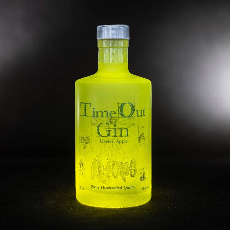 TimeOut Gin Green Apple 50cl bottle with vibrant green color, showcasing Swiss handcrafted quality and unique flavors.