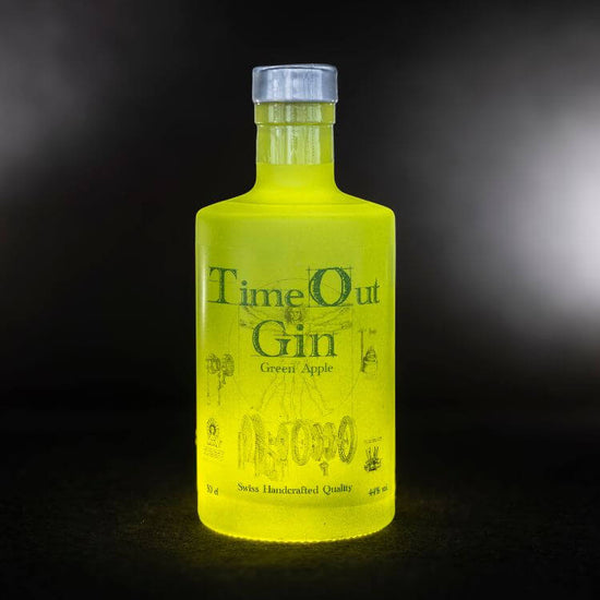 TimeOut Gin Green Apple 50cl bottle with vibrant green color, showcasing Swiss handcrafted quality and unique flavors.