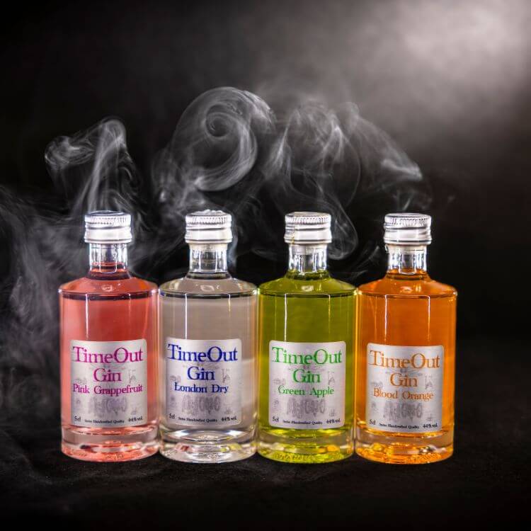 TimeOut Tasting Set displaying four gin flavors: Pink Grapefruit, London Dry, Green Apple, and Blood Orange.