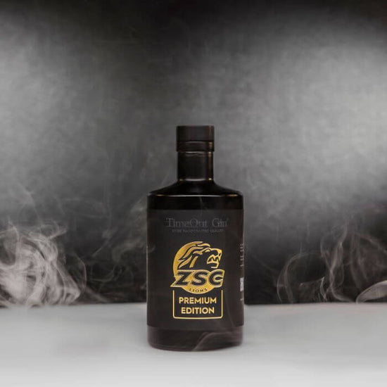 ZSC Lions Premium Edition gin bottle with smoky background, highlighting premium quality and exclusive enjoyment.