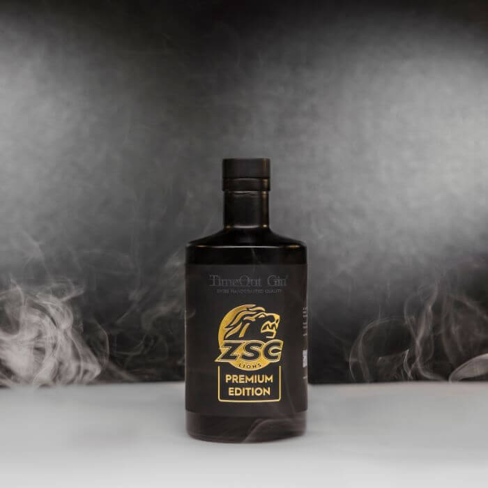 ZSC Lions Premium Edition gin bottle with smoky background, highlighting premium quality and exclusive enjoyment.