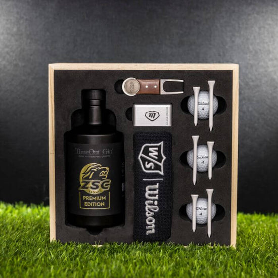 Exklusive Golferbox mit TimeOut Gin, Golfbällen, Tüchern und Zubehör für Golfliebhaber.